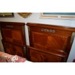 PAIR OF MAHOGANY AND BRASS BOUND BEDS