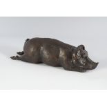 BRONZE SCULPTURE OF A RECLINING PIG