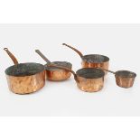 19TH-CENTURY GRADUATED COPPER SAUCEPANS