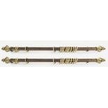 PAIR OF EBONIZED AND BRASS CURTAIN POLES