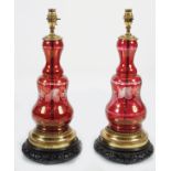 PAIR OF BRASS AND RUBY GLASS STEMMED TABLE LAMPS