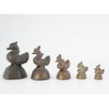 GROUP OF FIVE ORIENTAL BRONZE OPIUM WEIGHTS