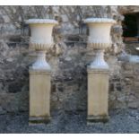 PAIR OF MARBLE URNS ON STANDS