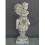 GROUP OF FOUR ITALIANATE STONE PUTTI