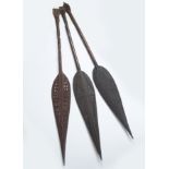 THREE EARLY CARVED TRIBAL CEREMONIAL SPEARS