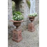 PAIR OF NEO-CLASSICAL TERRACOTTA URNS