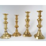 GROUP OF FOUR GEORGIAN BRASS CANDLESTICKS