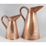 SET OF TWO GRADUATED COPPER EWERS