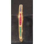 18CT YELLOW GOLD SAPPHIRE RUBY AND EMERALD BANGLE