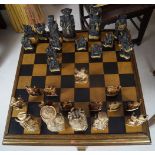 CHESS TABLE AND 30 ANIMALIA AND FIGURAL PIECES