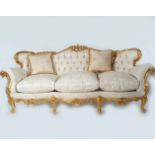 ROCOCO CARVED AND PARCEL GILT SETTEE
