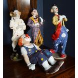 GROUP OF FOUR CLOWN FIGURINES