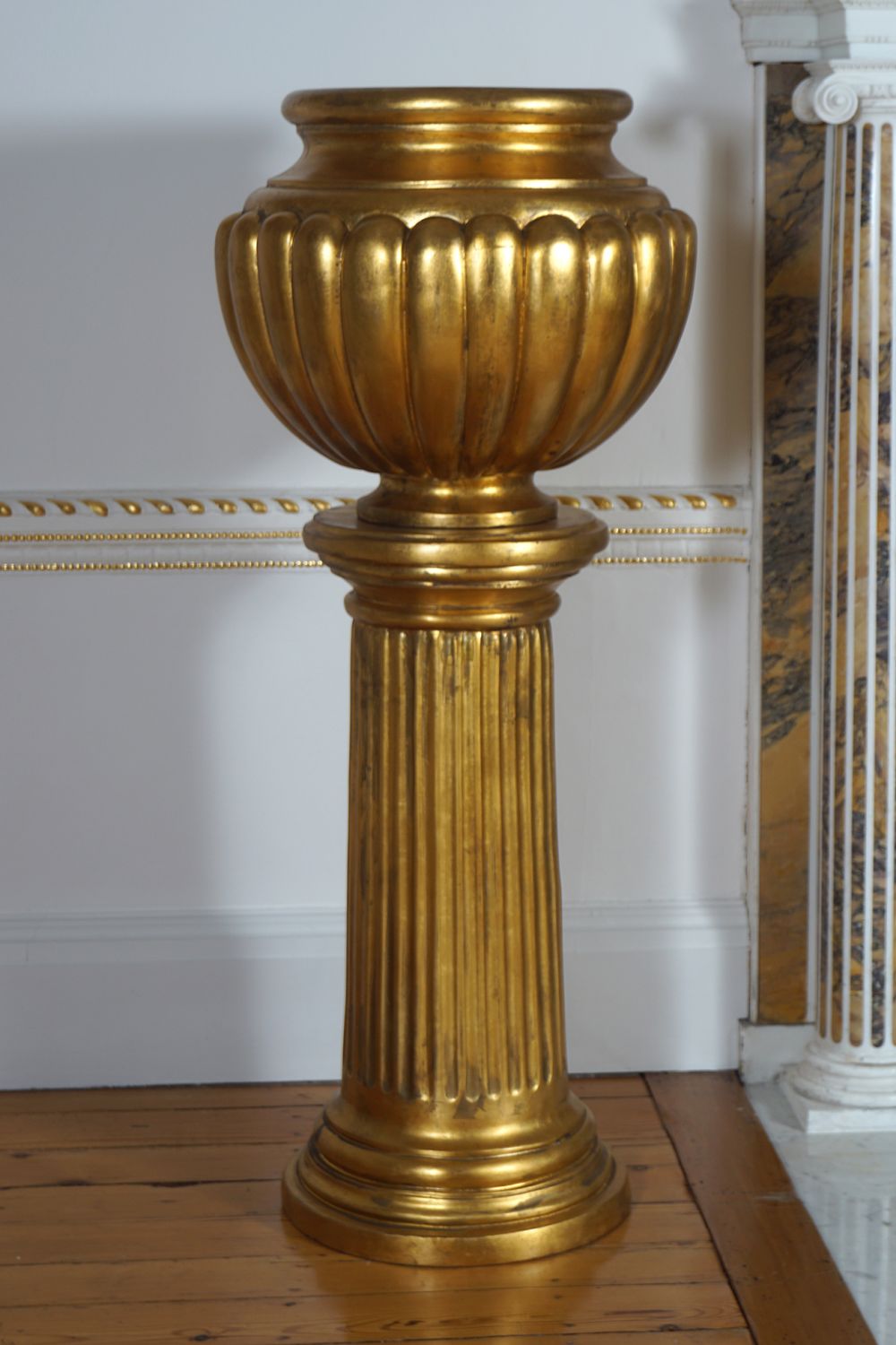 PAIR OF LARGE MOULDED GILDED JARDINIERES