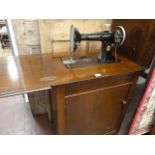 Singer sewing machine in mahogany cabinet