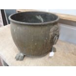 Brass cauldron with lion mask ring handles on paw feet