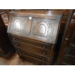 Carved oak priory style bureau