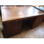 Waring and Gillow mahogany ministry or campaign style pedestal desk with cupboards to rear and