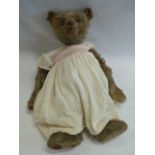 Early 20thC straw filled hump back Teddy Bear