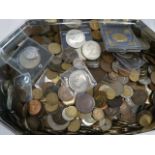 Tin of British and foreign coins