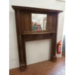 Early 20thC oak mirrored fire surround