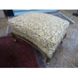 Gilt wood cushioned footstool upholstered in a gold and red classic foliate design fabric