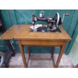 Early 20thC 'Vesta' cast iron sewing machine in oak table