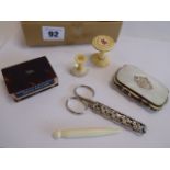 Mother of pearl purse, tortoiseshell matchbox holder, cotton bobbins,