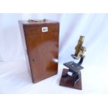 Leitz brass and cast iron microscope in mahogany case, with lenses,