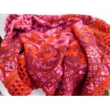 Vintage orange and pink floral pattern woollen bedspread with knotted macrame borders (Approx 122"