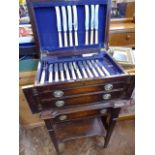 Edwardian oak lift lid canteen table with hinged pillasters containing part set of silver plated