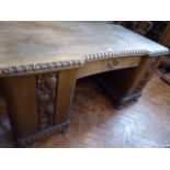 Early 20thC carved oak office desk - decorated with grapes and vine leaves