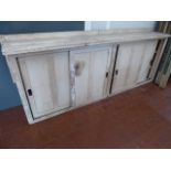 Early 20thC painted utility cupboard with 4 sliding doors