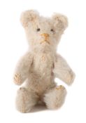 Kleiner Teddy wohl Bing, 50er Jahre, weißes Mohair, gegliedert, gestickte Nase und Krallen in