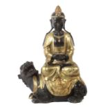 Bodhisattva auf Reittier China, 20. Jh., Gelbguss, part. schwarz patiniert, in vajrasana auf