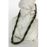''A NECKLACE WITH JADE BEADS 2 strands. 40 cm long, clasp giltKeywords: jewellery,