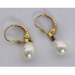 ''A PAIR OF DROP EARRINGS 585/000 yellow gold with drop-shaped pearls. 25 mm long, gross
