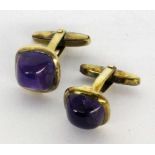 ''A PAIR OF CUFFLINKS 585/000 yellow gold with amethyst cabochons. Gross weight approx. 9.7