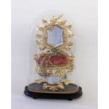 A GLOBE OF MARIÉE France 19th century Glass case with a wax flower bouquet on a chair.<