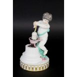 A PUTTO WITH HOT COALS Meissen, Marcolini 1774 - 1814 Putto on a pillar base with a pot of