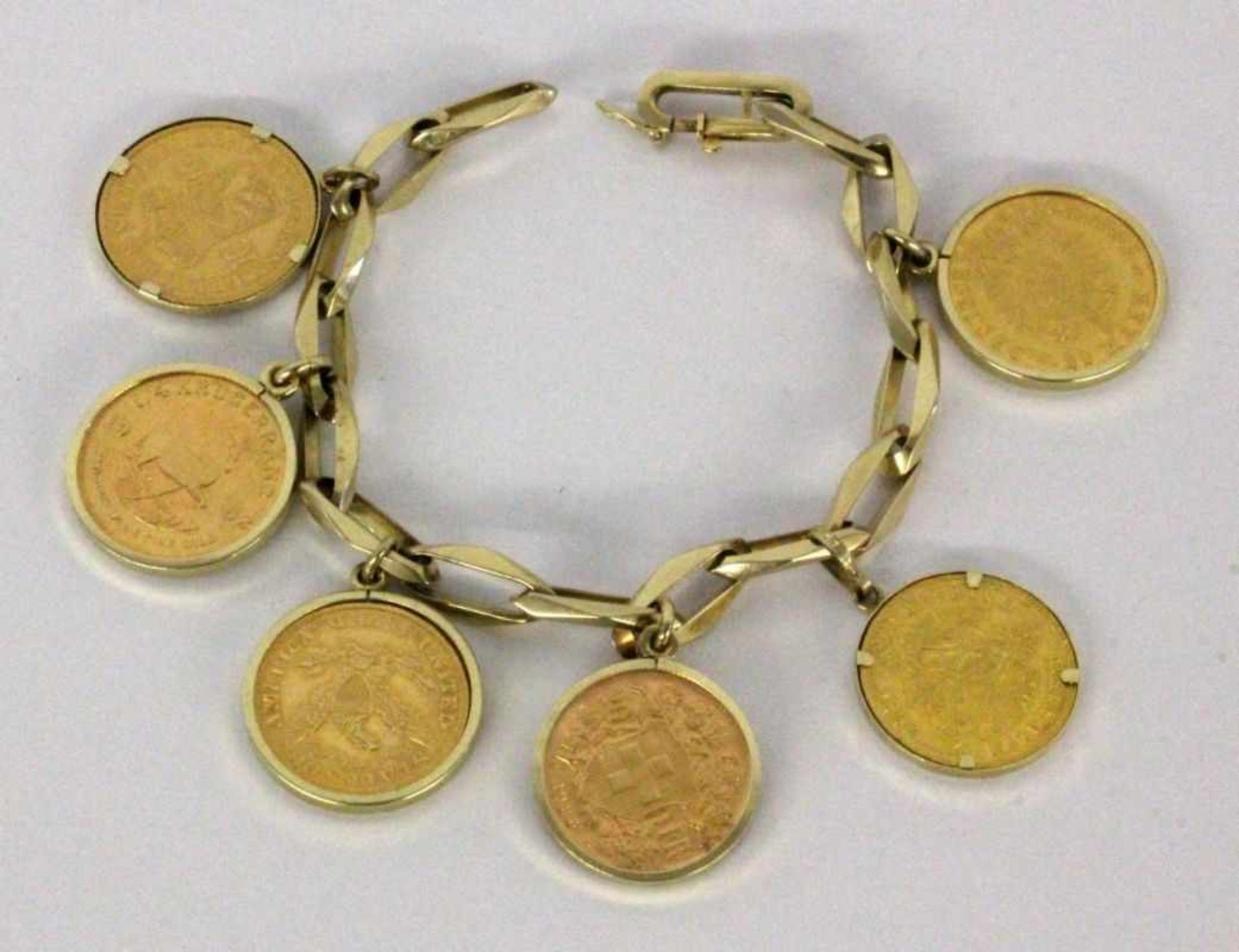 ''A WATCH CHAIN WITH 6 COIN PENDANTS 585/000 yellow gold with 6 gold coins: 20 marks