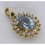 ''A PENDANT 585/000 yellow gold with aquamarine and brilliant cut diamonds. Diameter