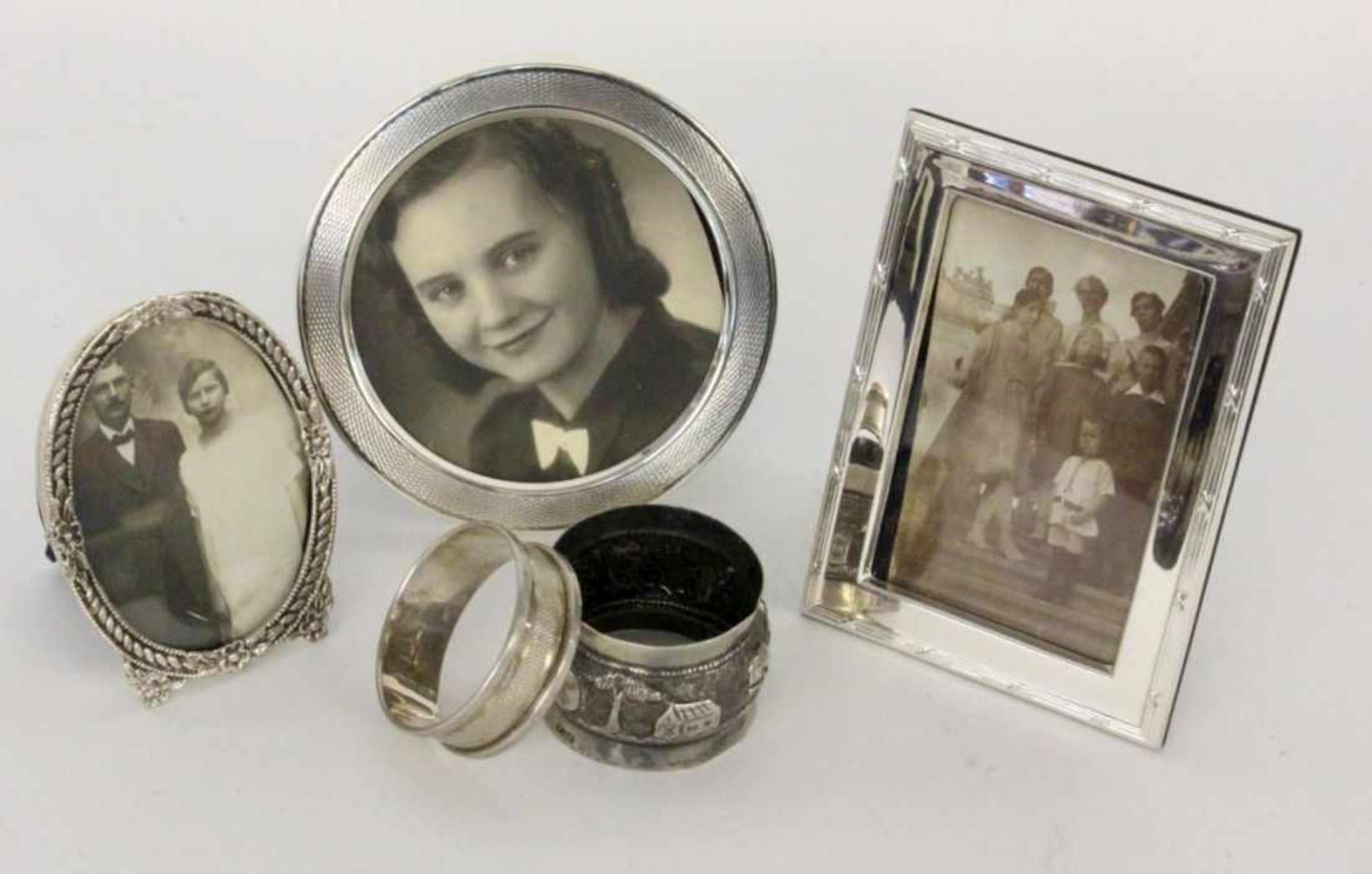 ''A LOT OF 5 SILVER ITEMS 3 photograph frames and 2 napkin ringsKeywords: miscellaneous''
