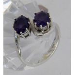 ''A LADIES RING 750/000 yellow gold with 2 amethysts. Ring size 55, gross weight approx.