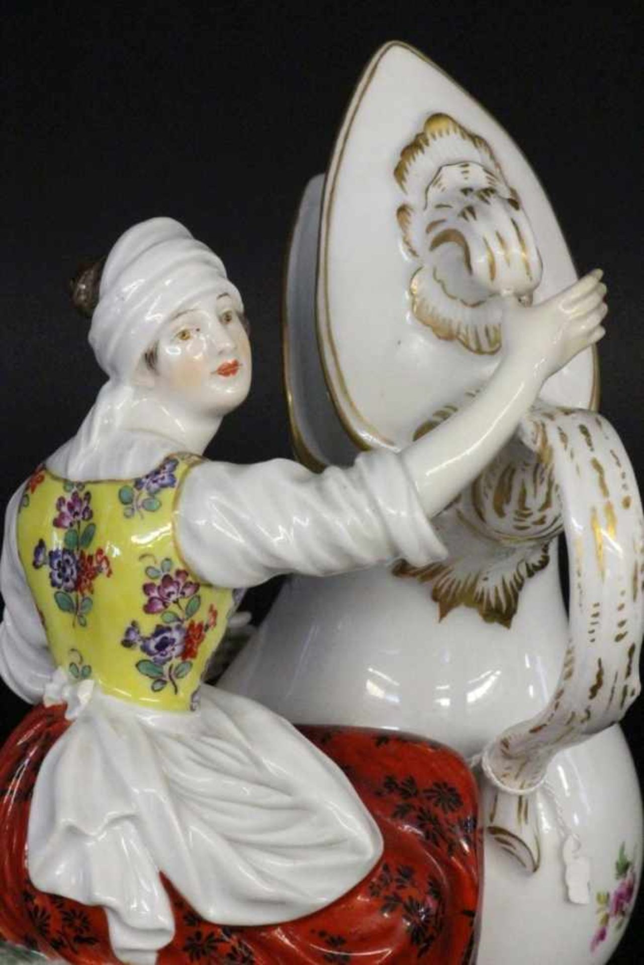 WOMAN WITH JUG Meissen 1860 - 1924 Polychrome decorated group of figures. Design by Johann