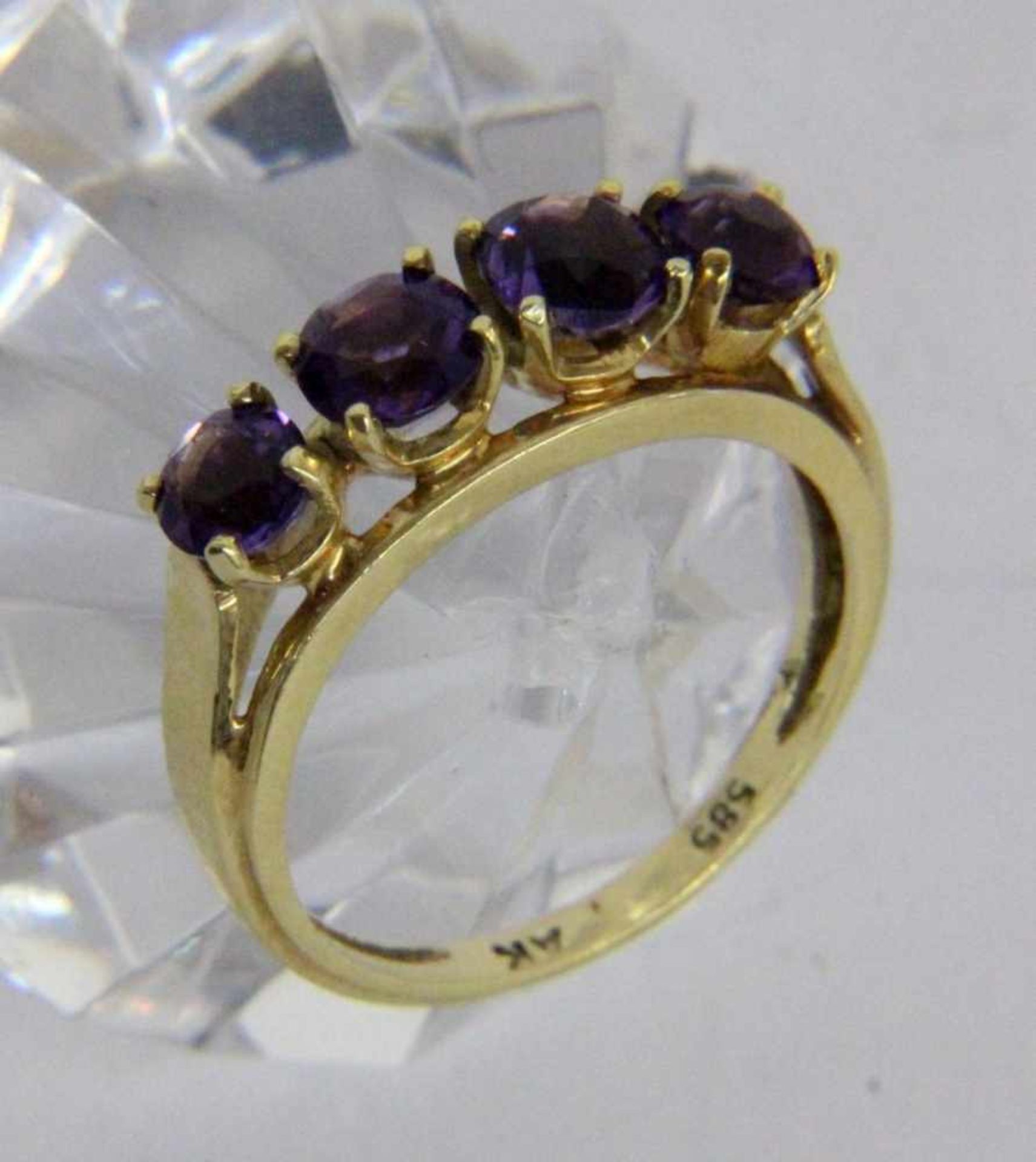 ''A LADIES RING 585/000 yellow gold with 4 amethysts. Ring size 54, gross weight approx.