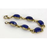 ''A BRACELET Silver gilt with lapis lazuli cabochons. 18.5 cm longKeywords: jewellery,