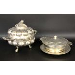''A SOUP AND A VEGETABLE TUREEN WITH PLATE, silver-plated metal. Diameter 22/24.5