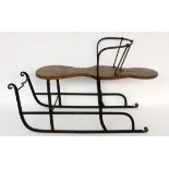 AN OLD SLEIGH Iron frame, wooden seat. 100 cm long