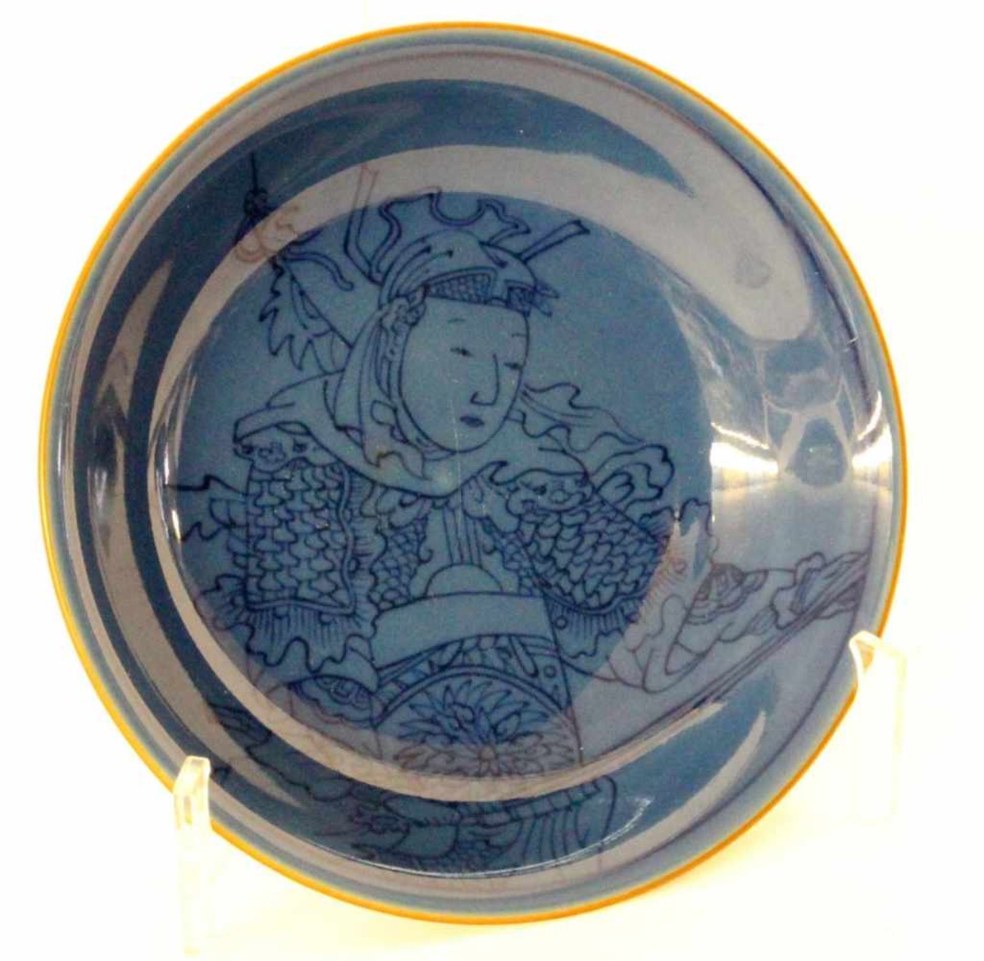 ''A BOWL Japan. Porcelain with blue glaze and a samurai painted under the glaze. Diameter