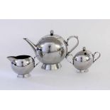 A NICK MUNRO DESIGNER SERVICE High polished stainless steel. 3 pieces, consisting of tea